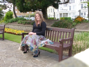Suzie on a bench in the public gardens